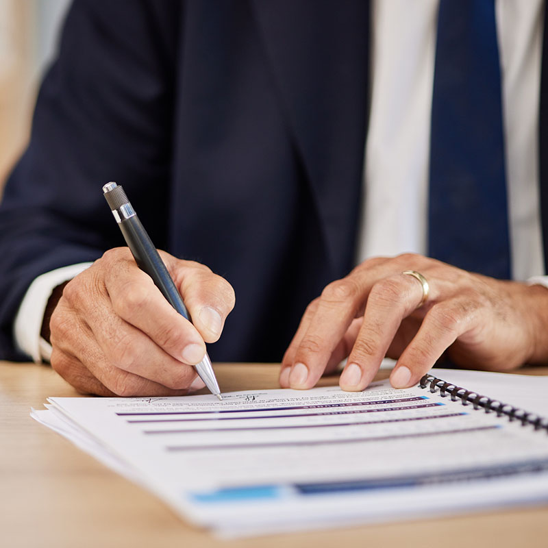 man in suit working on compliance