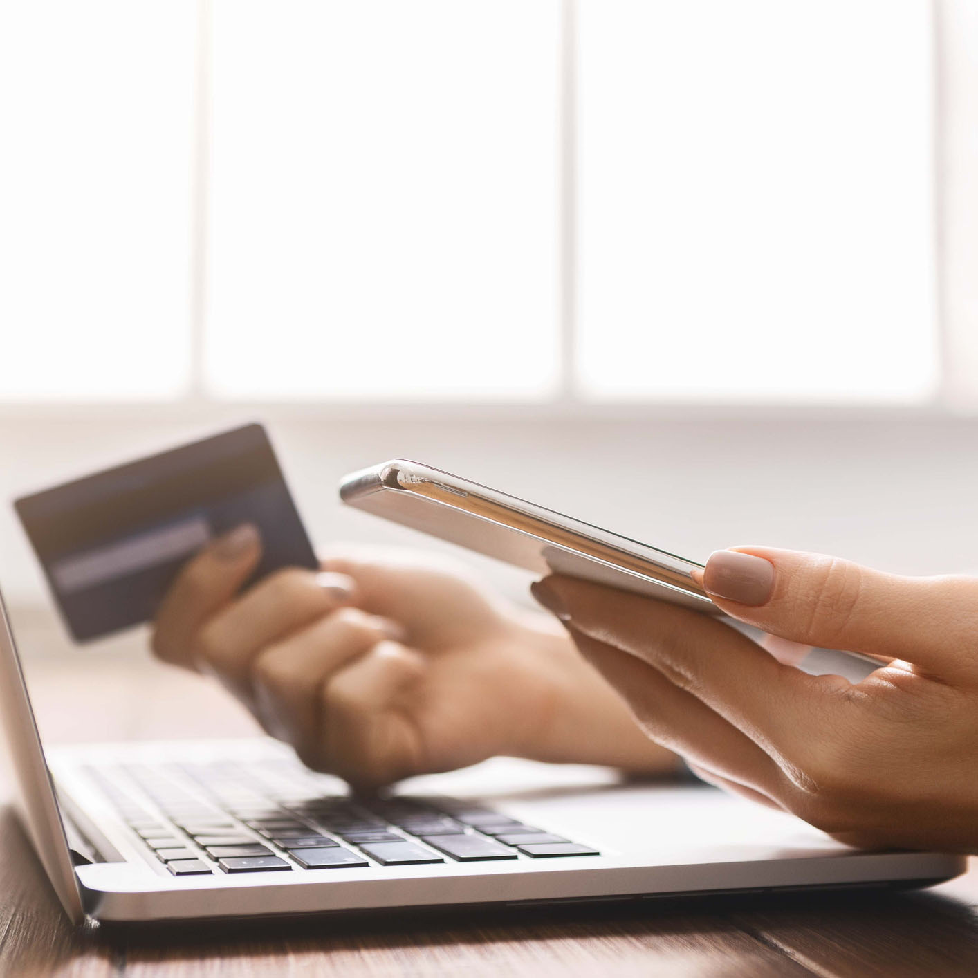 person using a credit card to pay online